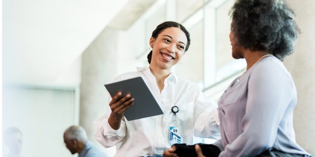 Young doctor talking with patient