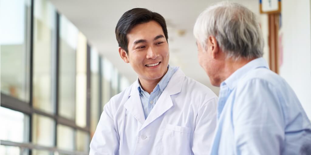 Concierge doctor talking with patient