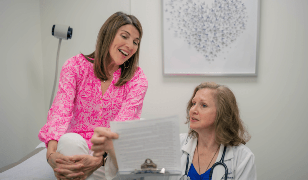 Dr. Jana Morse working with a female executive health patient in the exam room