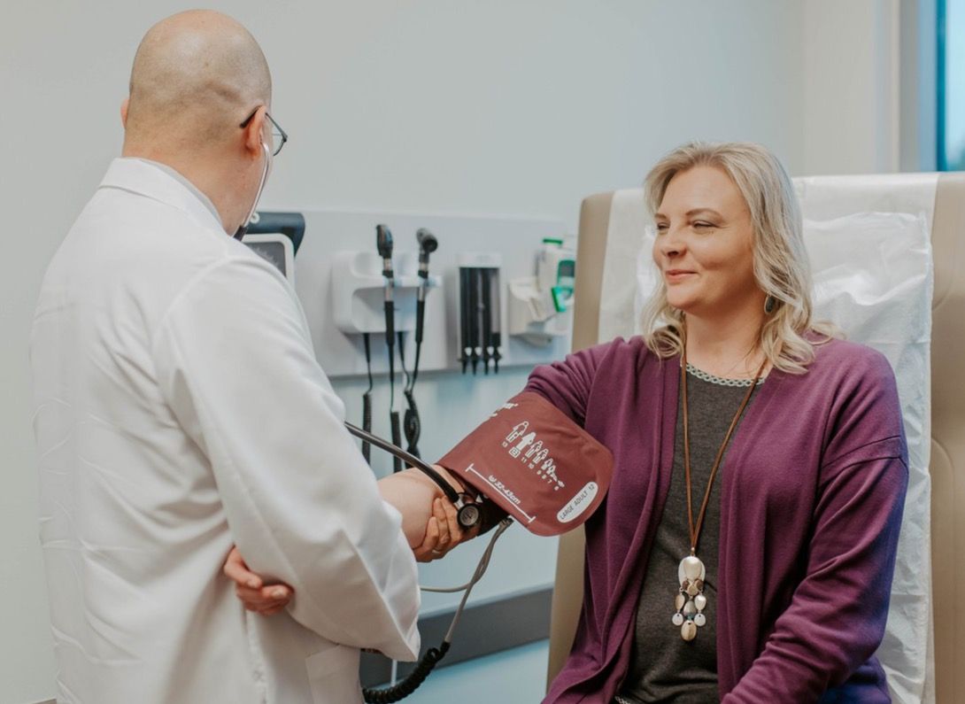 Dr. Pong, a concierge physician, examines a patient.