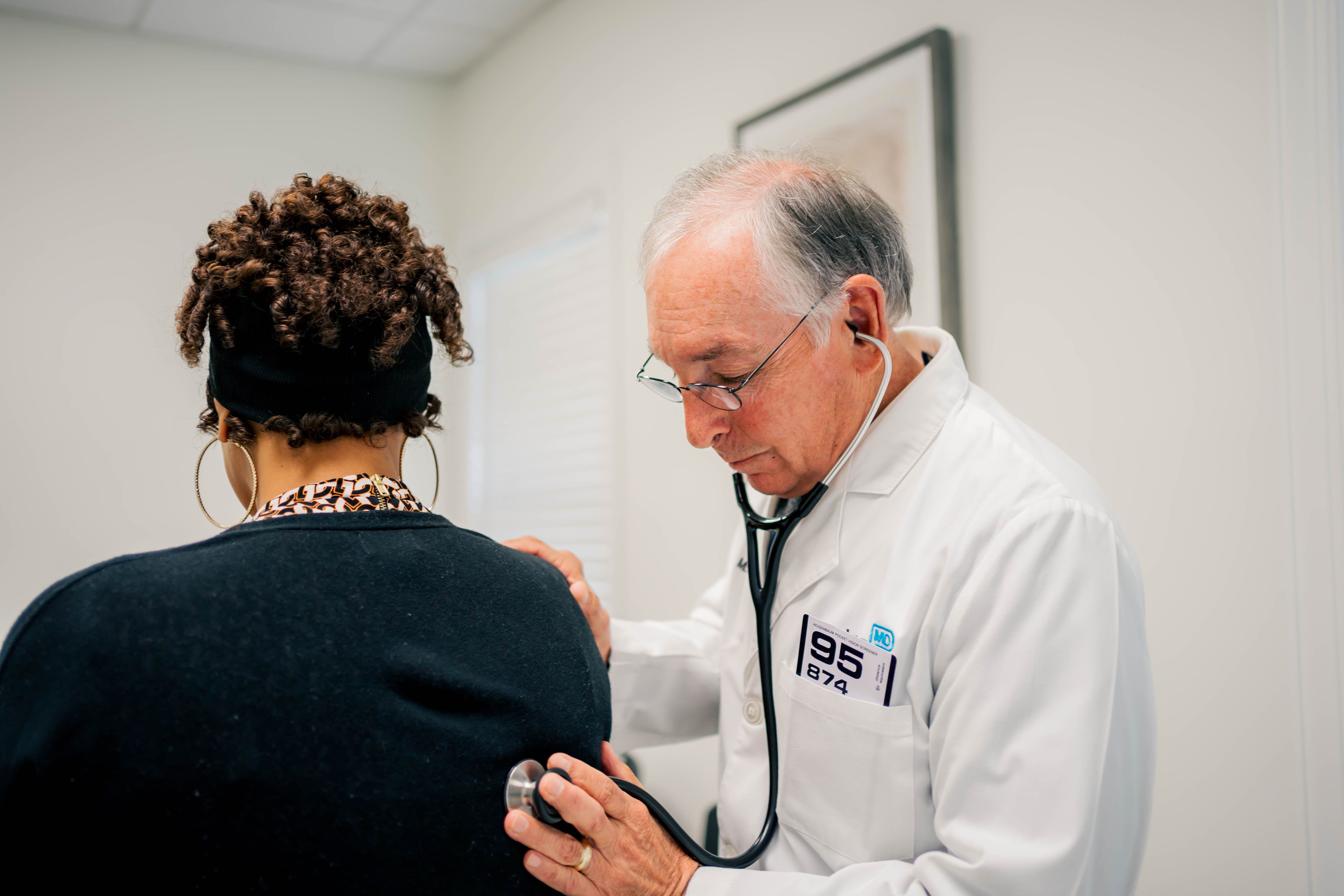 Dr. Jack Durham, concierge doctor at PartnerMD, listens to a patient