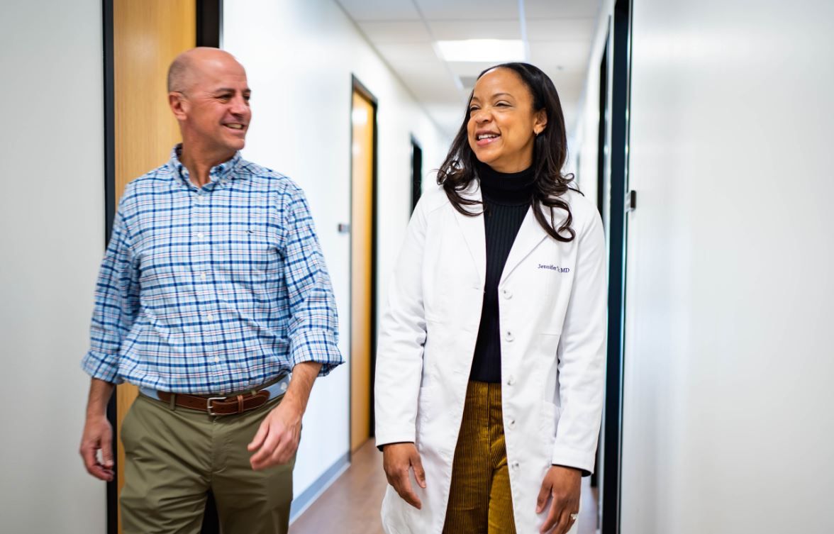 Dr. Jennifer Tutt walks with an executive health patient