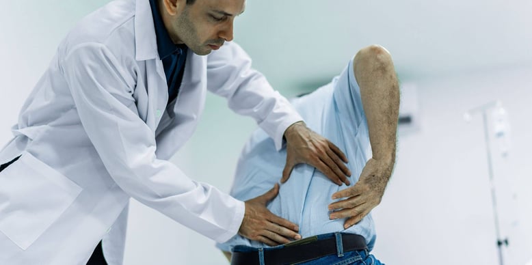 patient showing doctor their backpain