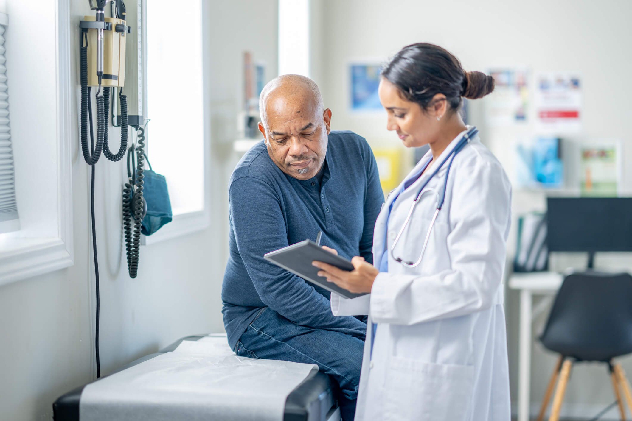 Executive health patient reviewing information