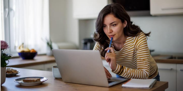 A woman doing research on laptop