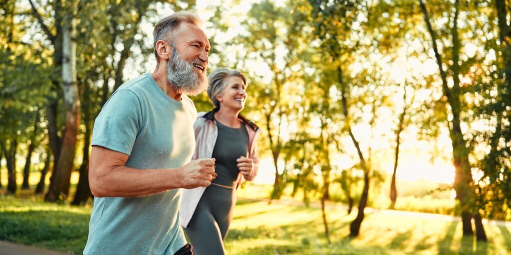 Older man and women running 